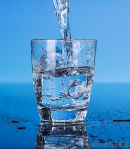 water-into-a-glass-blue-background